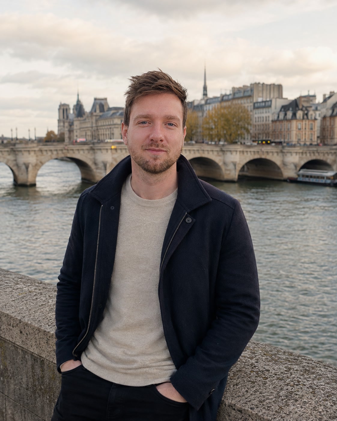 Aleksandr Kovalev photographed at the Pont Neuf in Paris, the Seine and the Île de la Cité behind him
